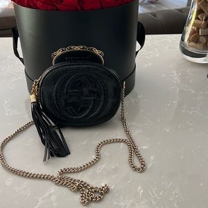 gucci black patent leather disco bag with light gold hardware.